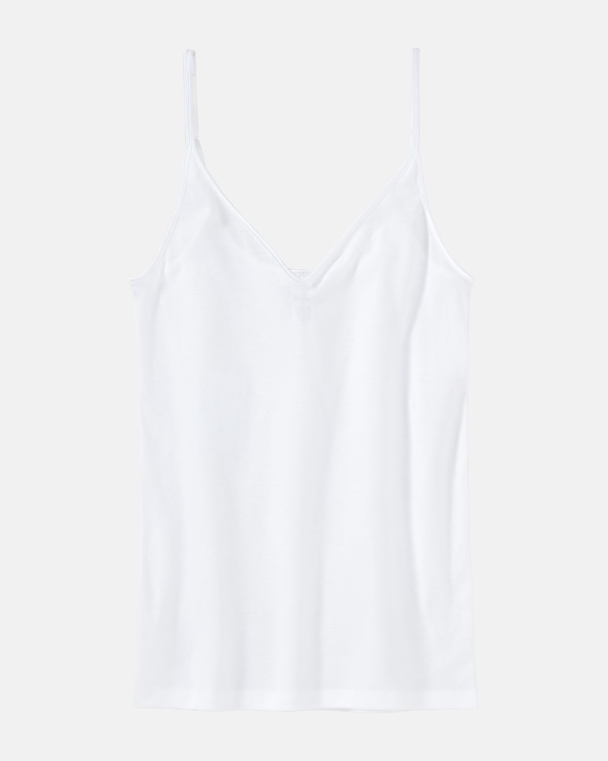Trägerhemd in weiß aus der Serie Natascha, flach auf einer Oberfläche liegend.