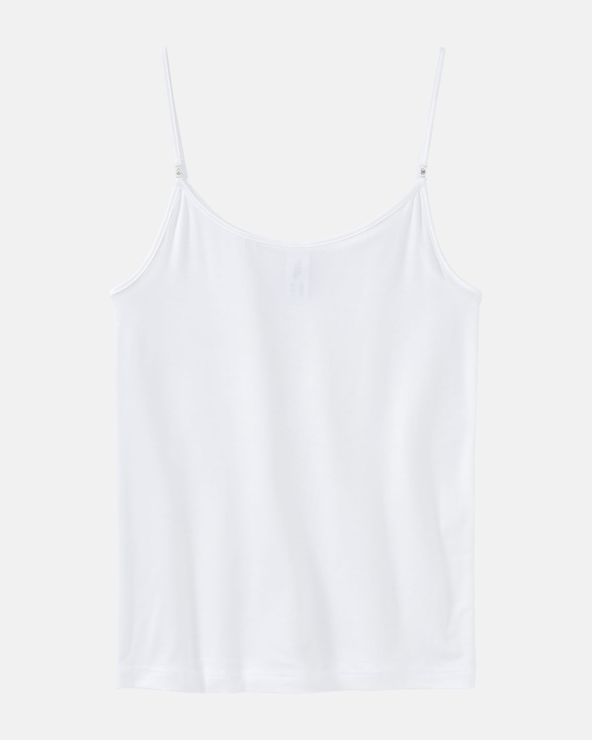 Hemd in weiß aus der Serie Sensuelle, flach auf einer Oberfläche liegend.