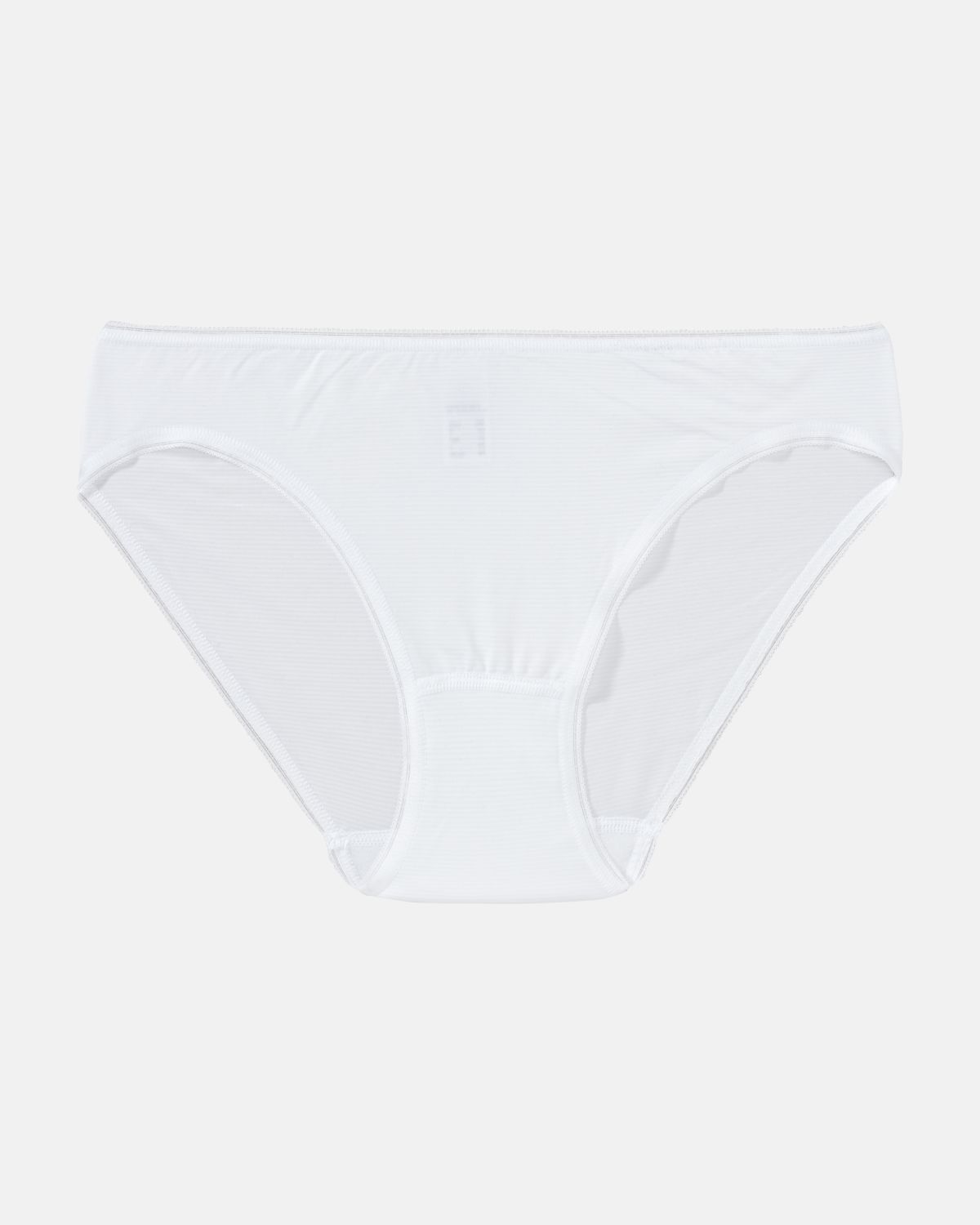 Minislip in weiß aus der Serie Magic look, flach auf einer Oberfläche liegend.