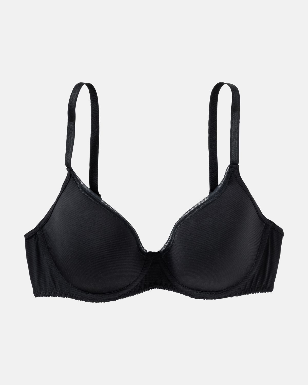 Schalen BH mit Bügel in schwarz aus der Serie Magic look, flach auf einer Oberfläche liegend.