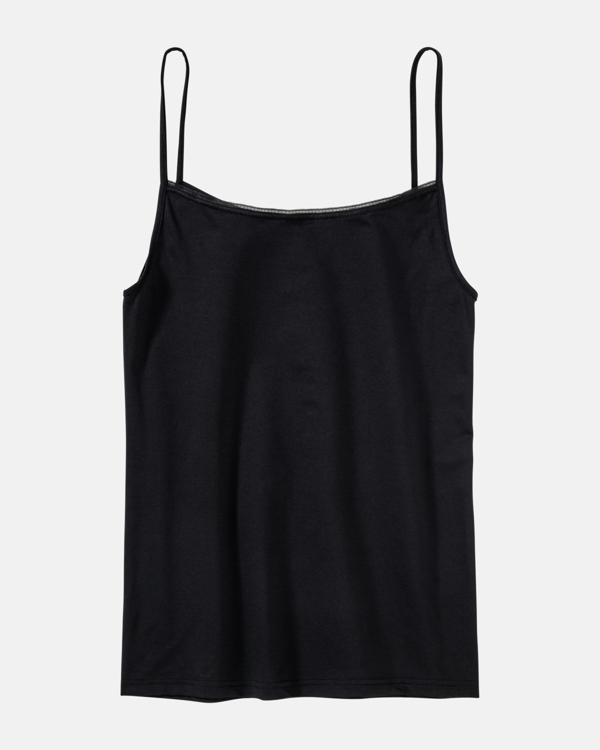 Hemd in schwarz aus der Serie Magic look, flach auf einer Oberfläche liegend.