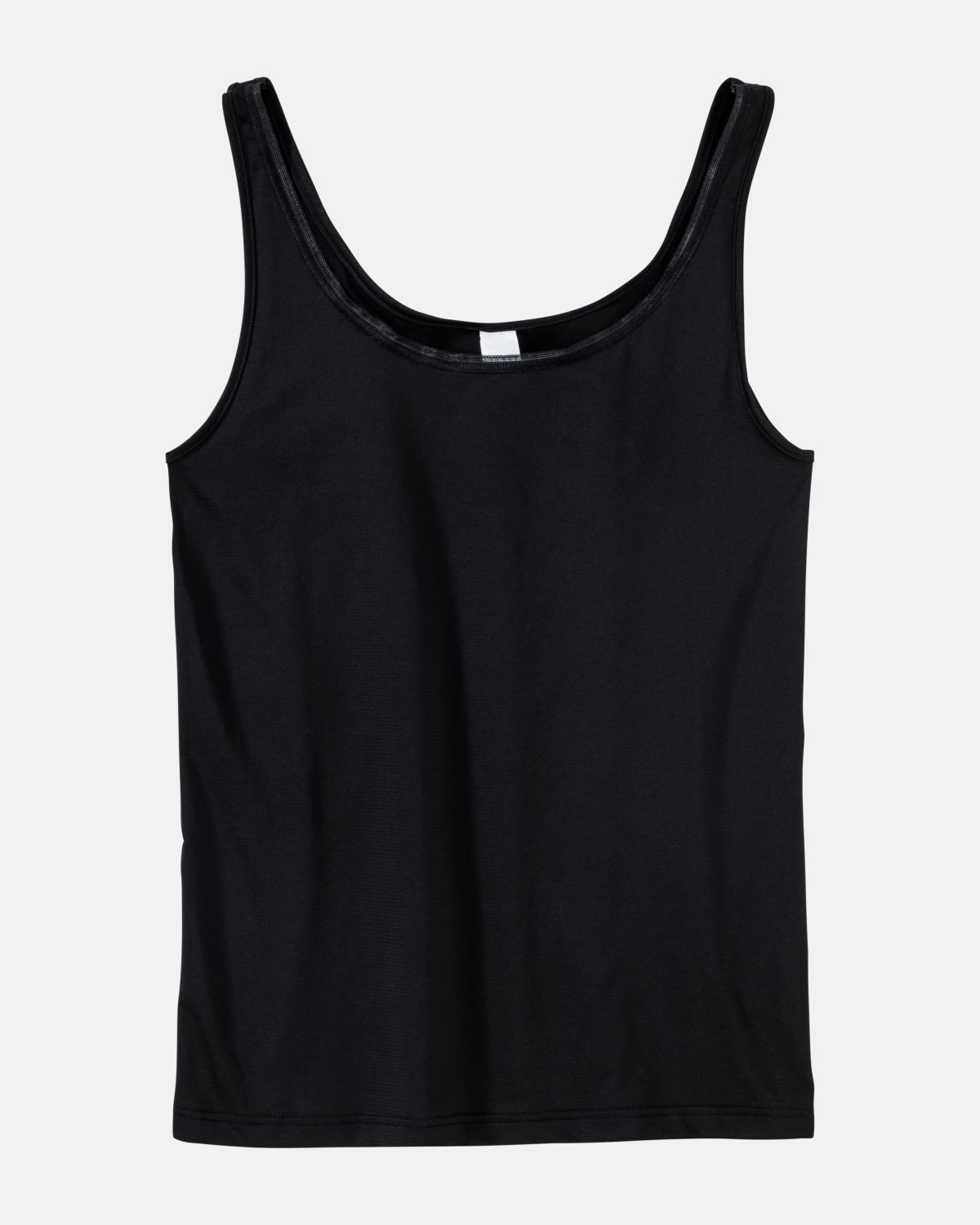 Achselhemd in schwarz aus der Serie Magic look, flach auf einer Oberfläche liegend.