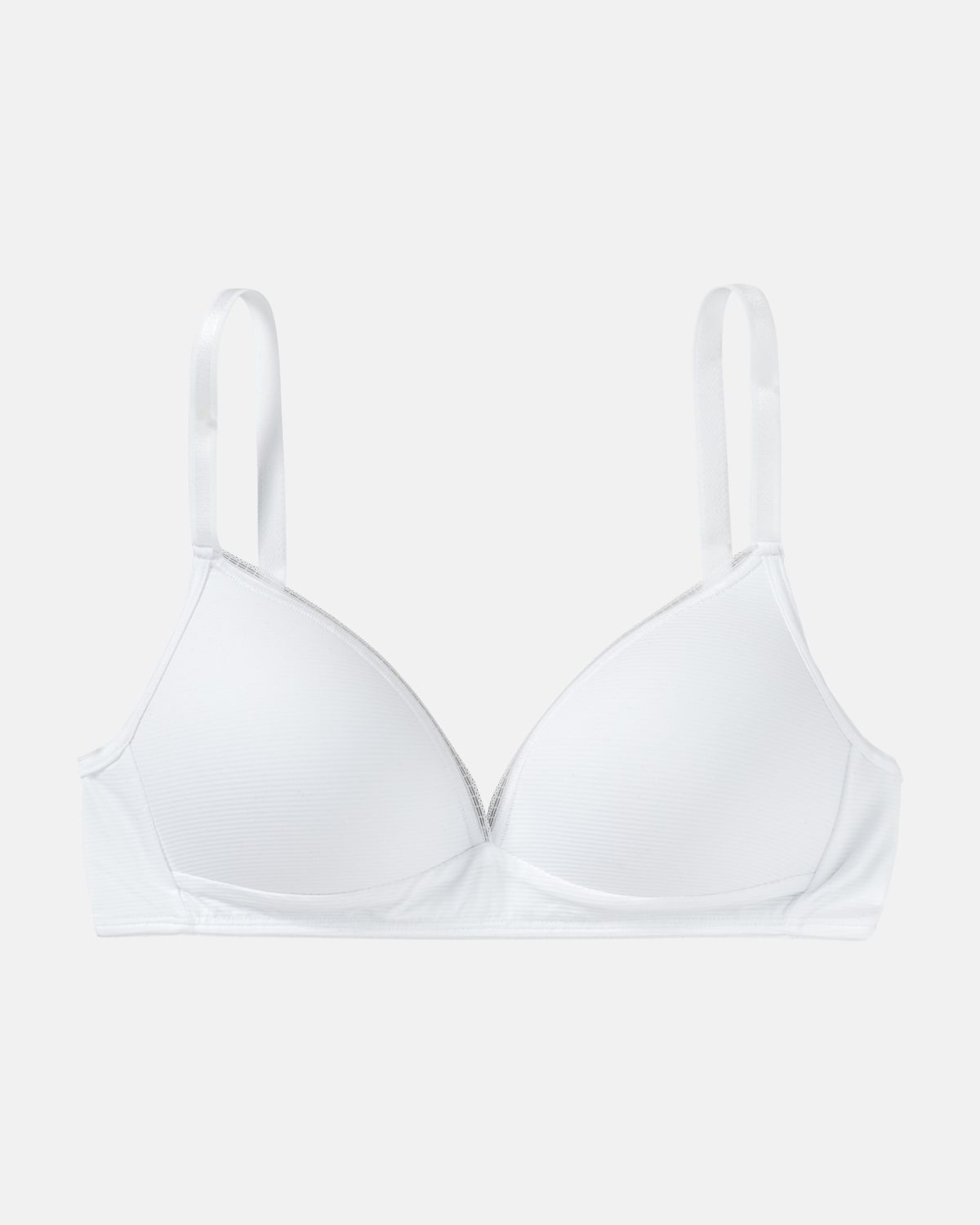 Schalen BH Triangle in weiß aus der Serie Magic look, flach auf einer Oberfläche liegend.