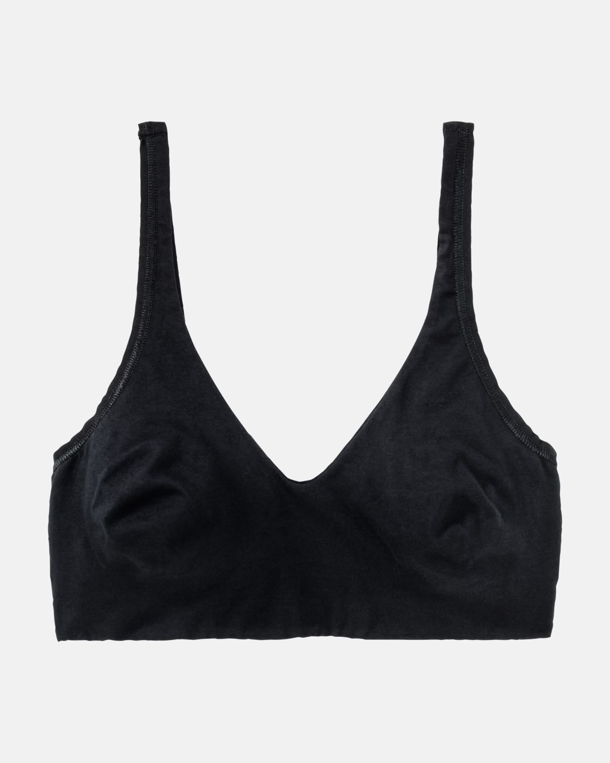 Soft BH gemoldet in schwarz aus der Serie Natural Beauty, flach auf einer Oberfläche liegend.