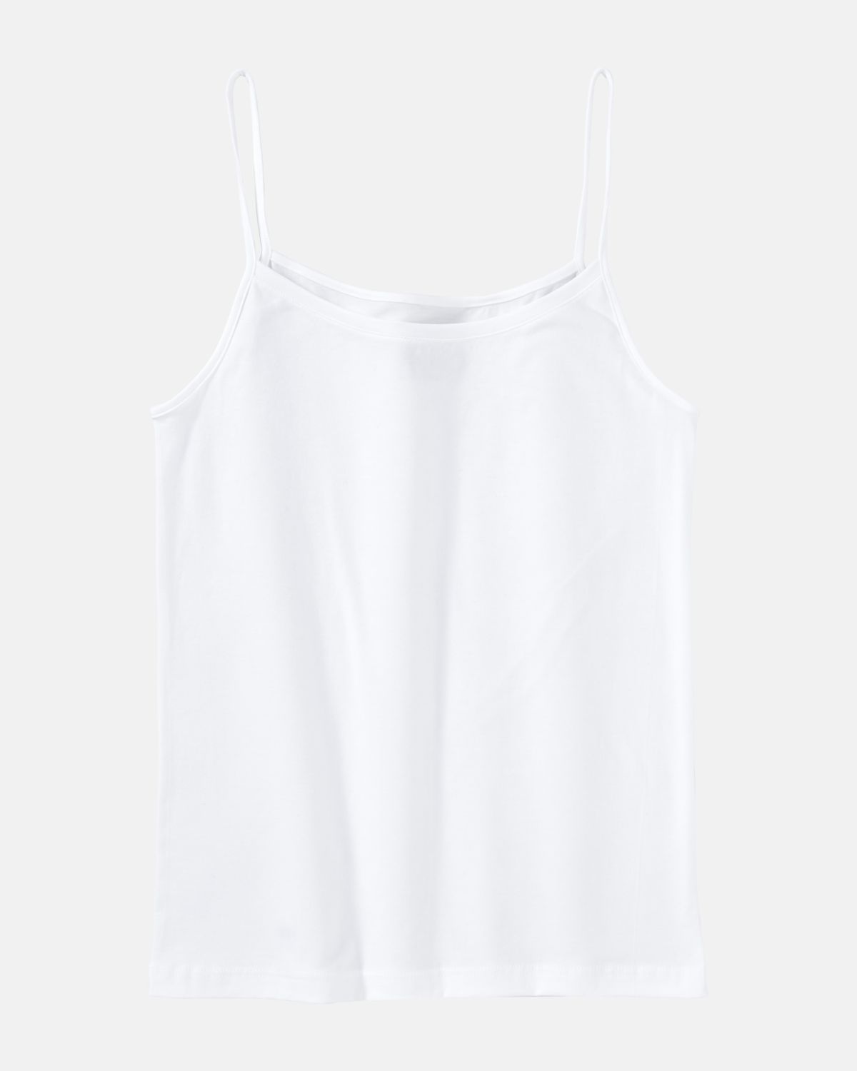 Spaghettitop in off white aus der Serie Natural Beauty, flach auf einer Oberfläche liegend.