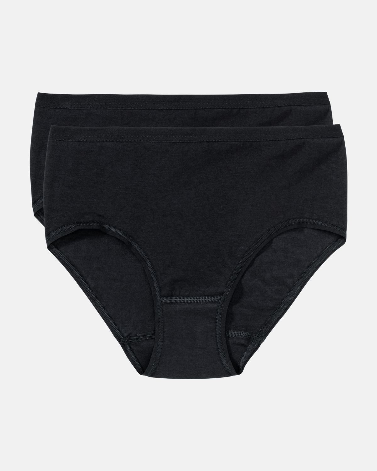 Midislip in schwarz aus der Serie Take two, flach auf einer Oberfläche liegend.