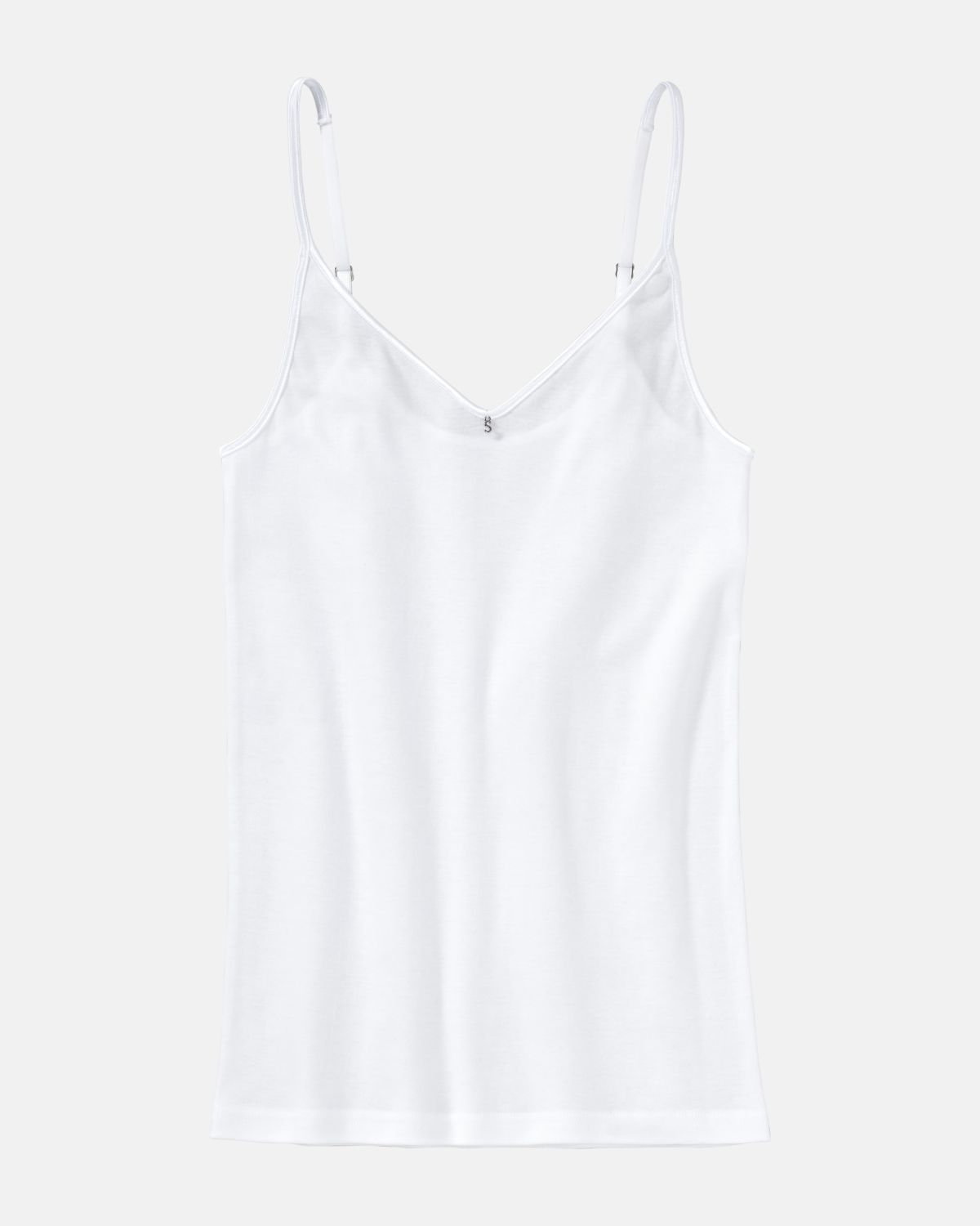 Hemd in weiß aus der Serie Silke, flach auf einer Oberfläche liegend.