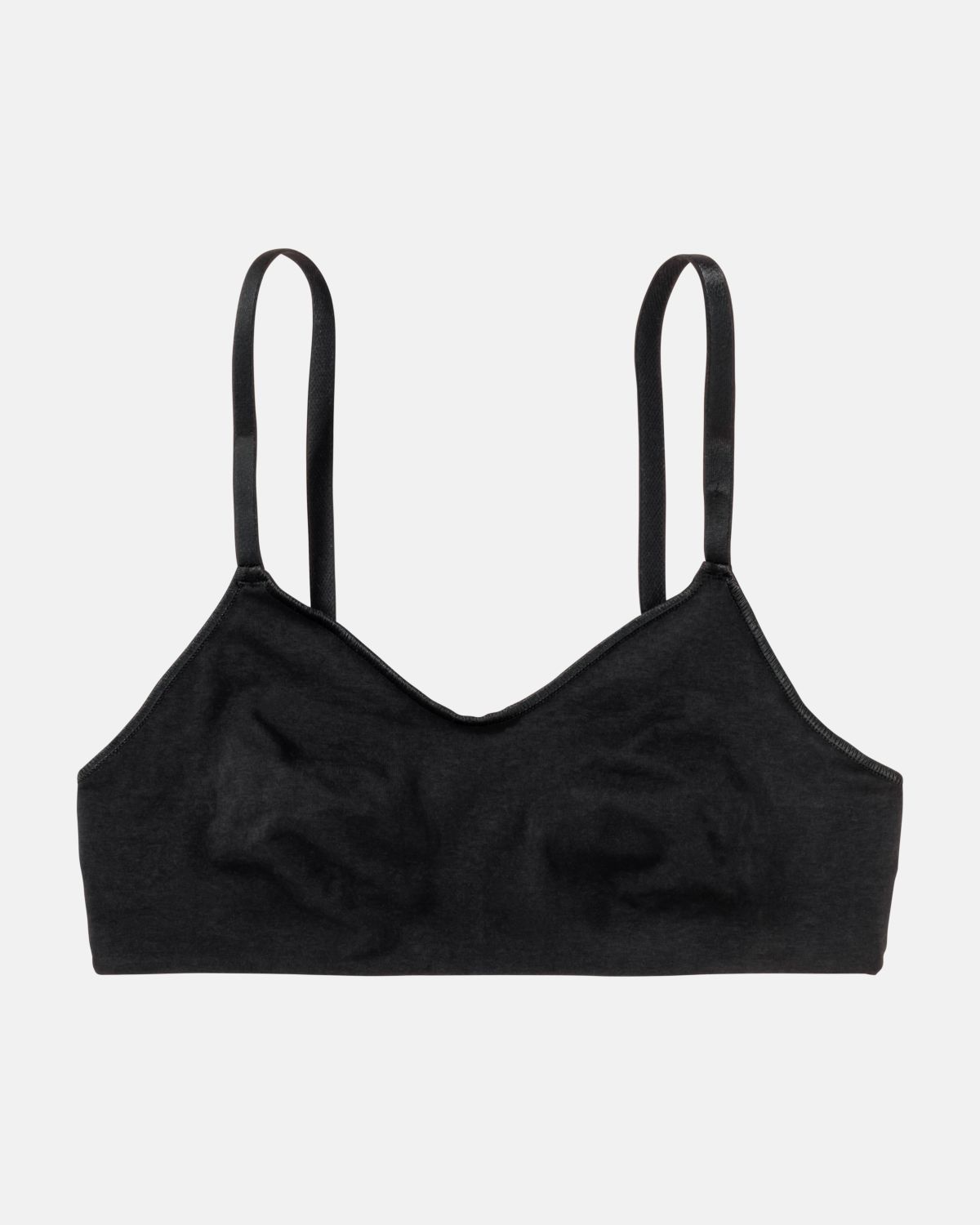 Soft BH gemoldet in schwarz aus der Serie Sally, flach auf einer Oberfläche liegend.