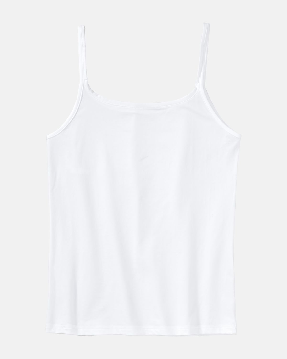 Trägerhemd in weiß aus der Serie Sidney, flach auf einer Oberfläche liegend.