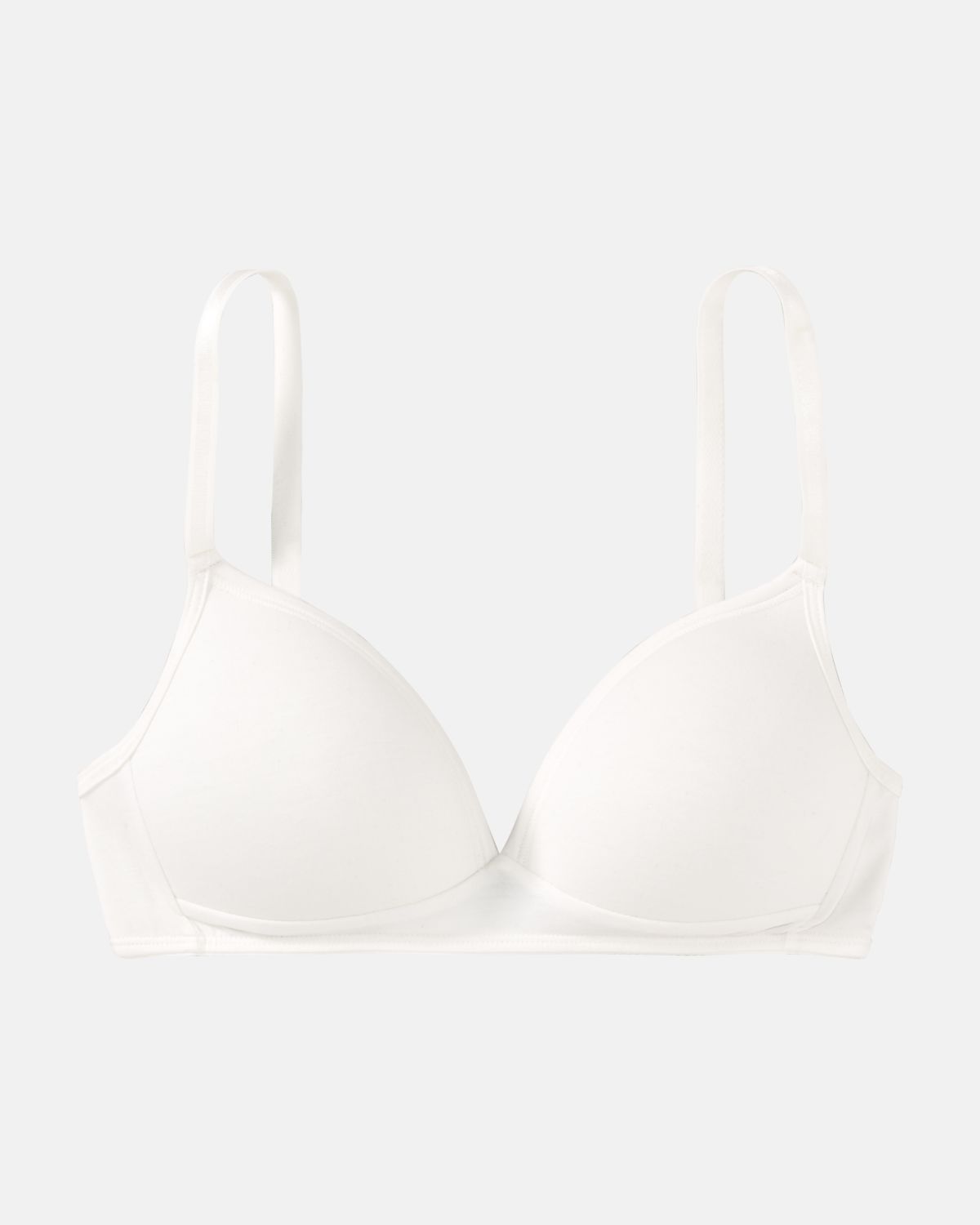 Schalen BH Triangle in elfenbein aus der Serie Swenja, flach auf einer Oberfläche liegend.