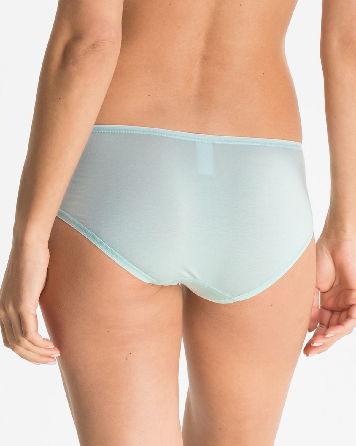 Model trägt Hipster in minze aus der Serie Romina, Ansicht von hinten.