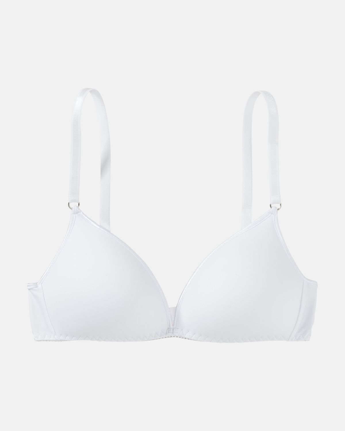Schalen BH Triangle in weiß aus der Serie Magic hip, flach auf einer Oberfläche liegend.