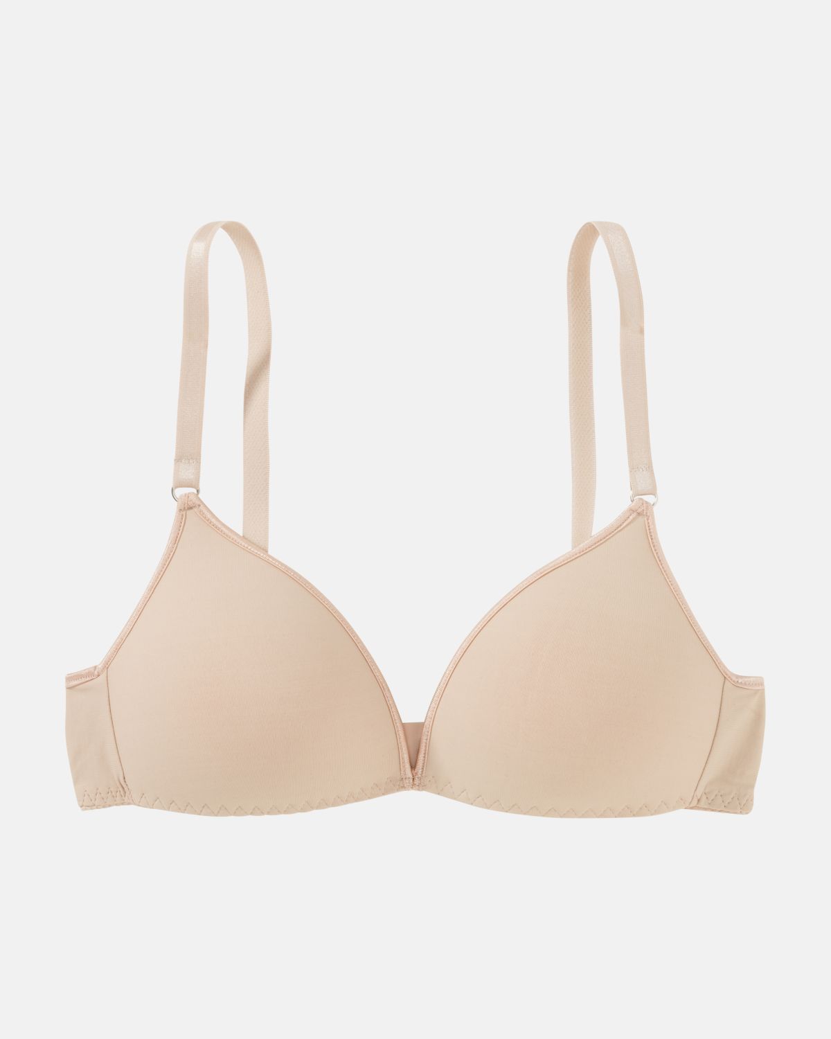 Schalen BH Triangle in skin aus der Serie Magic hip, flach auf einer Oberfläche liegend.