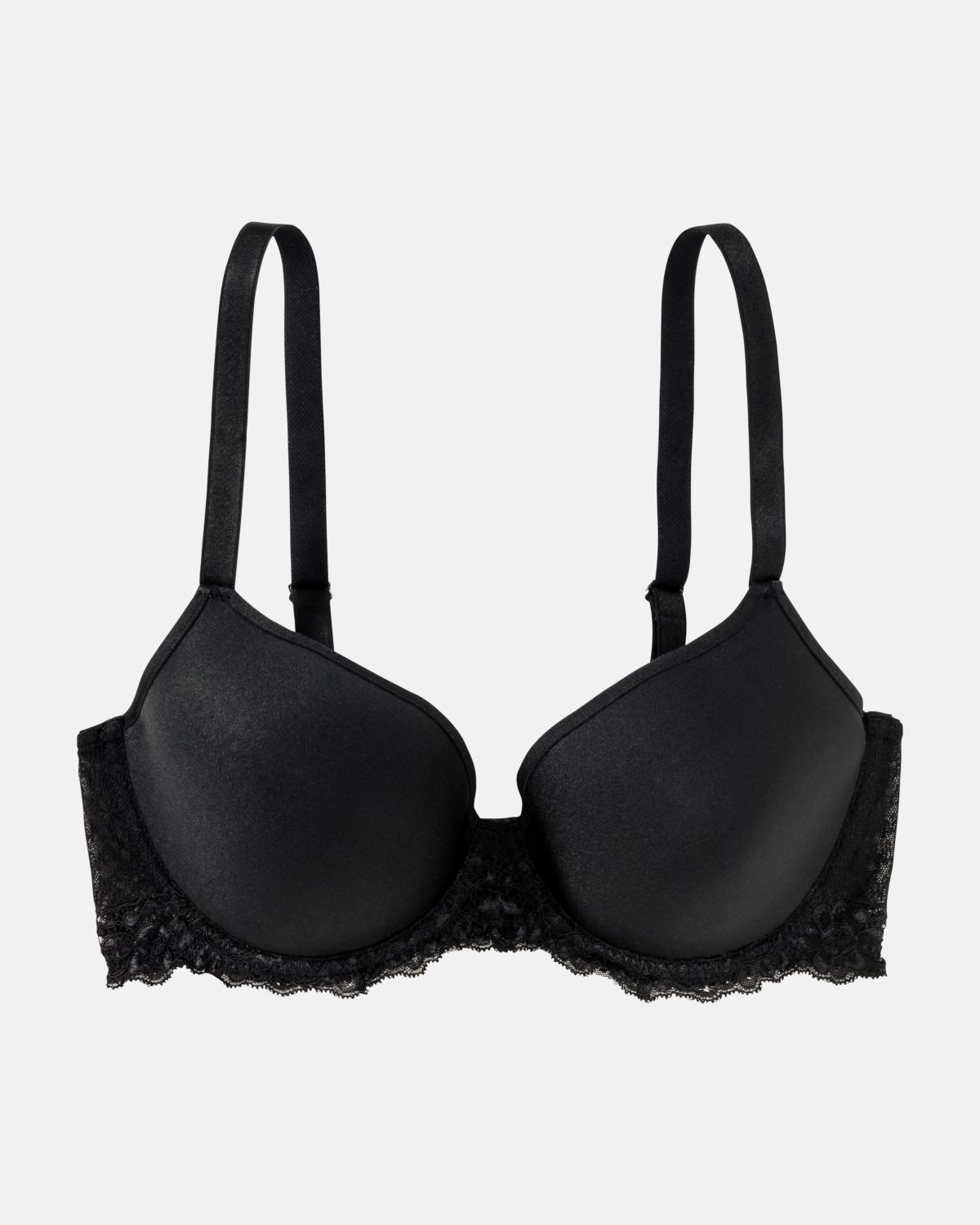 Schalen BH Spacer Cup in schwarz aus der Serie Priscilla, flach auf einer Oberfläche liegend.