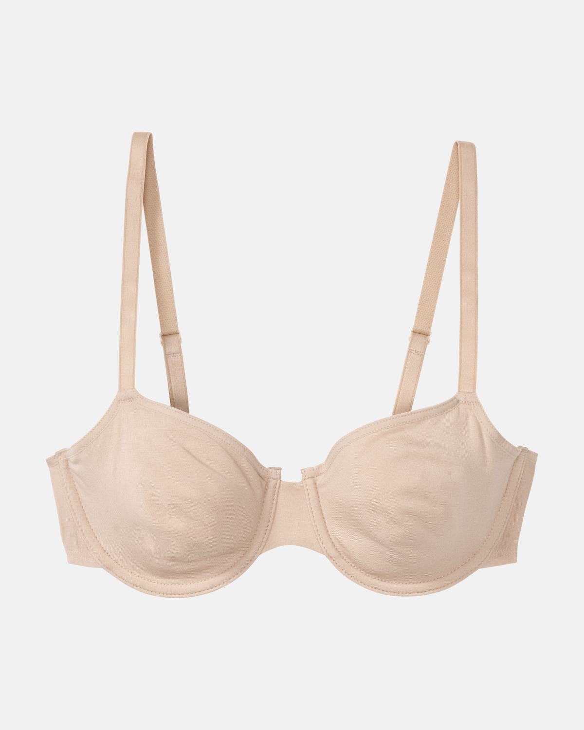 Bügel BH in skin aus der Serie Softfeeling, flach auf einer Oberfläche liegend.