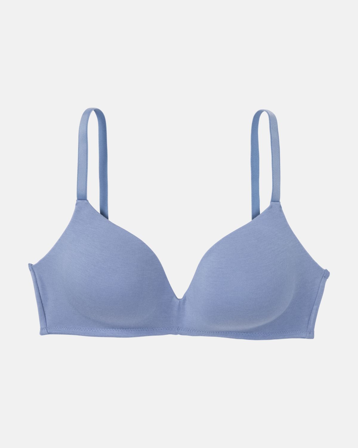 Schalen BH non wired in blue aus der Serie Softfeeling, flach auf einer Oberfläche liegend.