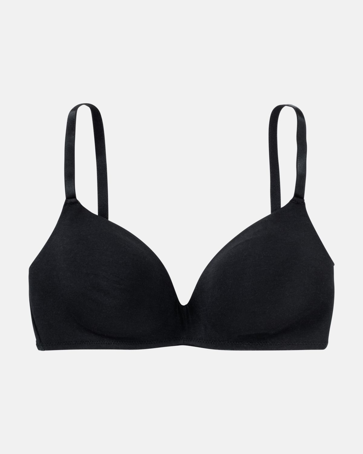 Schalen BH non wired in schwarz aus der Serie Softfeeling, flach auf einer Oberfläche liegend.