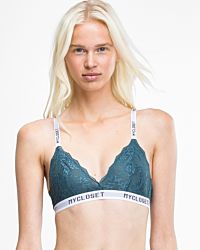 Model trägt Bralette in cord aus der Serie Logo Lover, Ansicht von vorne.