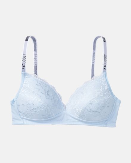 Schalen BH Triangle in aquamarin aus der Serie Logo Lover, flach auf einer Oberfläche liegend.