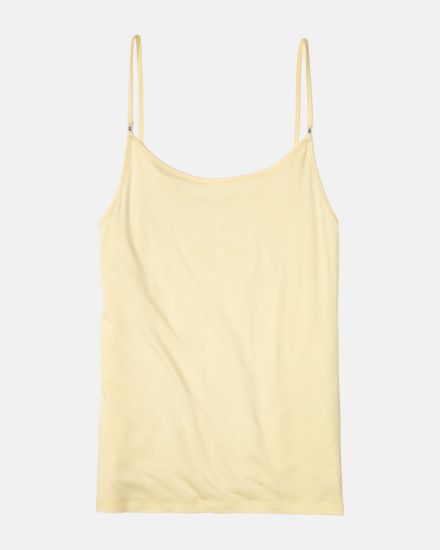 Hemd in zitrone aus der Serie Sensuelle, flach auf einer Oberfläche liegend.