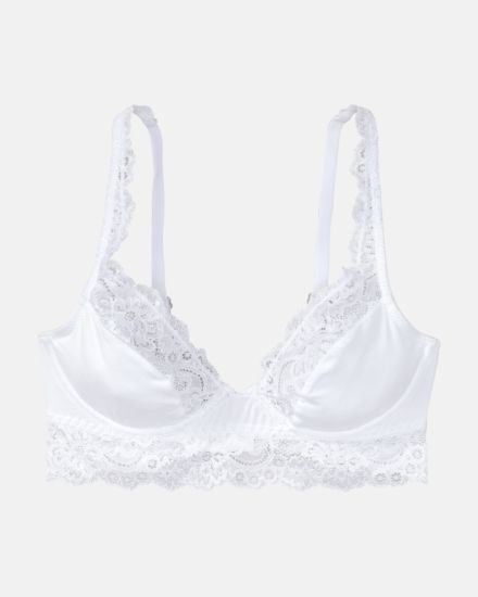 Bügel BH Longline in weiß aus der Serie Sensuelle Lace, flach auf einer Oberfläche liegend.