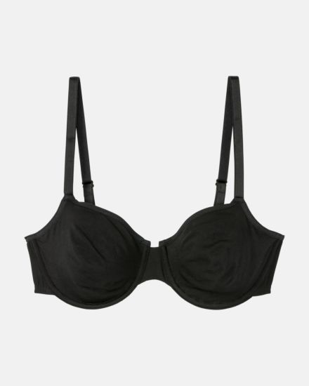 Bügel BH in schwarz aus der Serie Softfeeling, flach auf einer Oberfläche liegend.