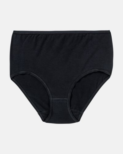 Maxislip in schwarz aus der Serie Natural Beauty, flach auf einer Oberfläche liegend.