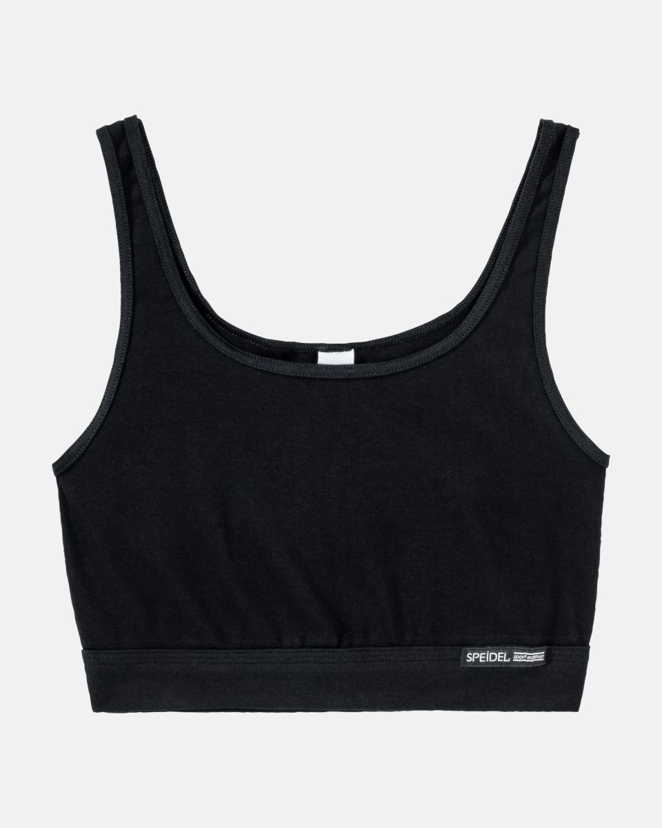 Trägerbustier in schwarz aus der Serie Bio Cotton, flach auf einer Oberfläche liegend.