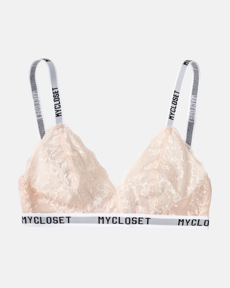 Bralette in lychee aus der Serie Logo Lover, flach auf einer Oberfläche liegend.