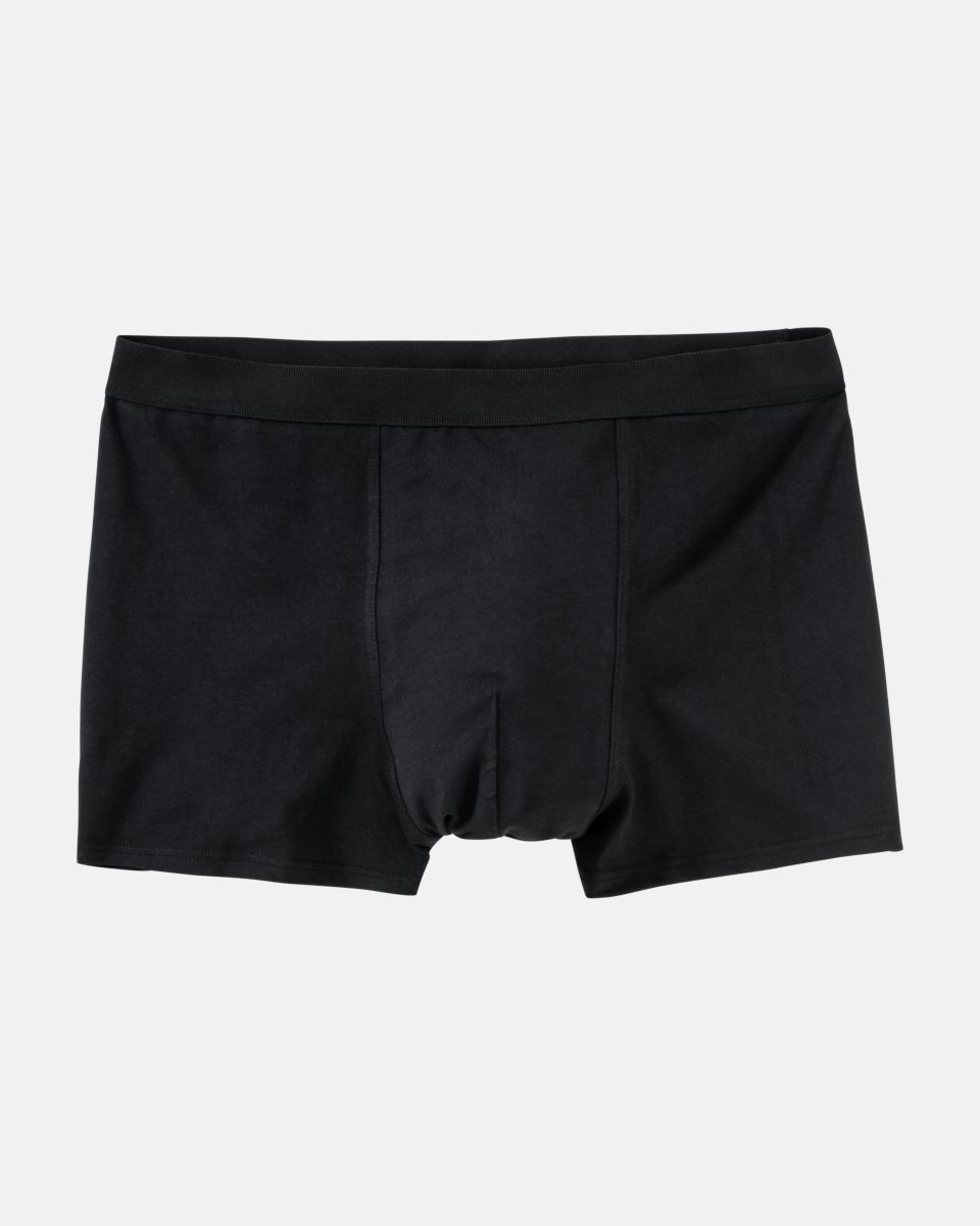 Herren Short in schwarz aus der Serie Classic, flach auf einer Oberfläche liegend.