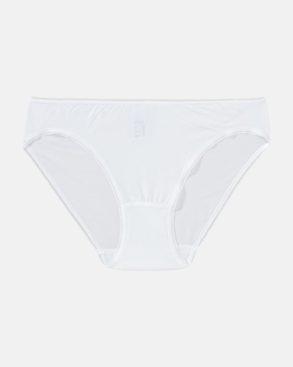 Minislip in weiß aus der Serie Magic look, flach auf einer Oberfläche liegend.