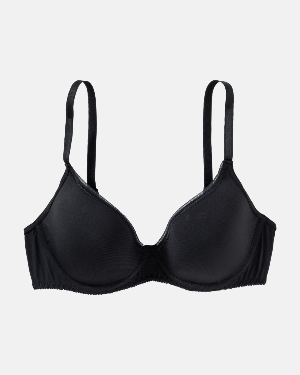 Schalen BH mit Bügel in schwarz aus der Serie Magic look, flach auf einer Oberfläche liegend.