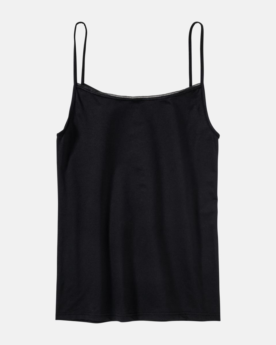 Hemd in schwarz aus der Serie Magic look, flach auf einer Oberfläche liegend.