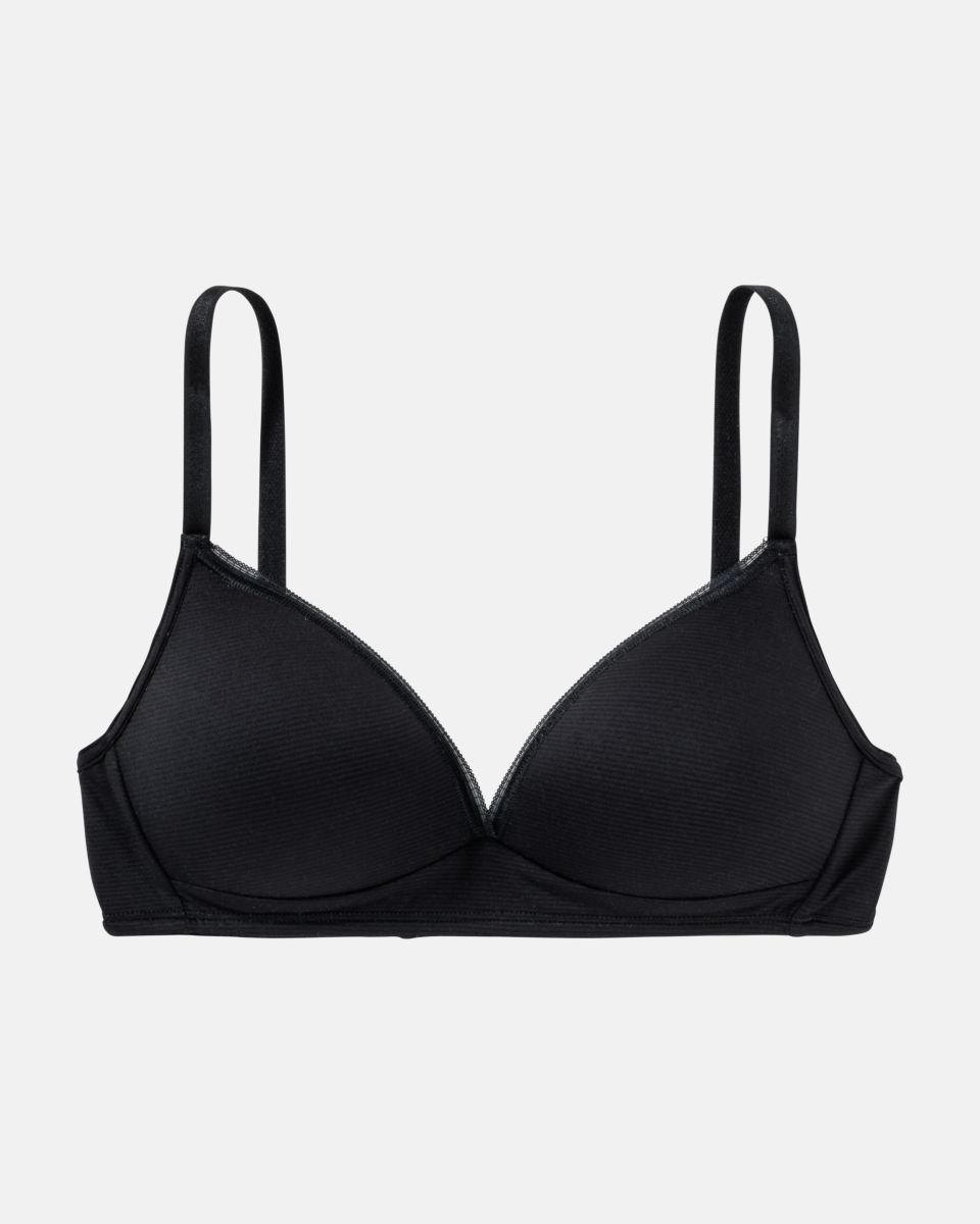Schalen BH Triangle in schwarz aus der Serie Magic look, flach auf einer Oberfläche liegend.