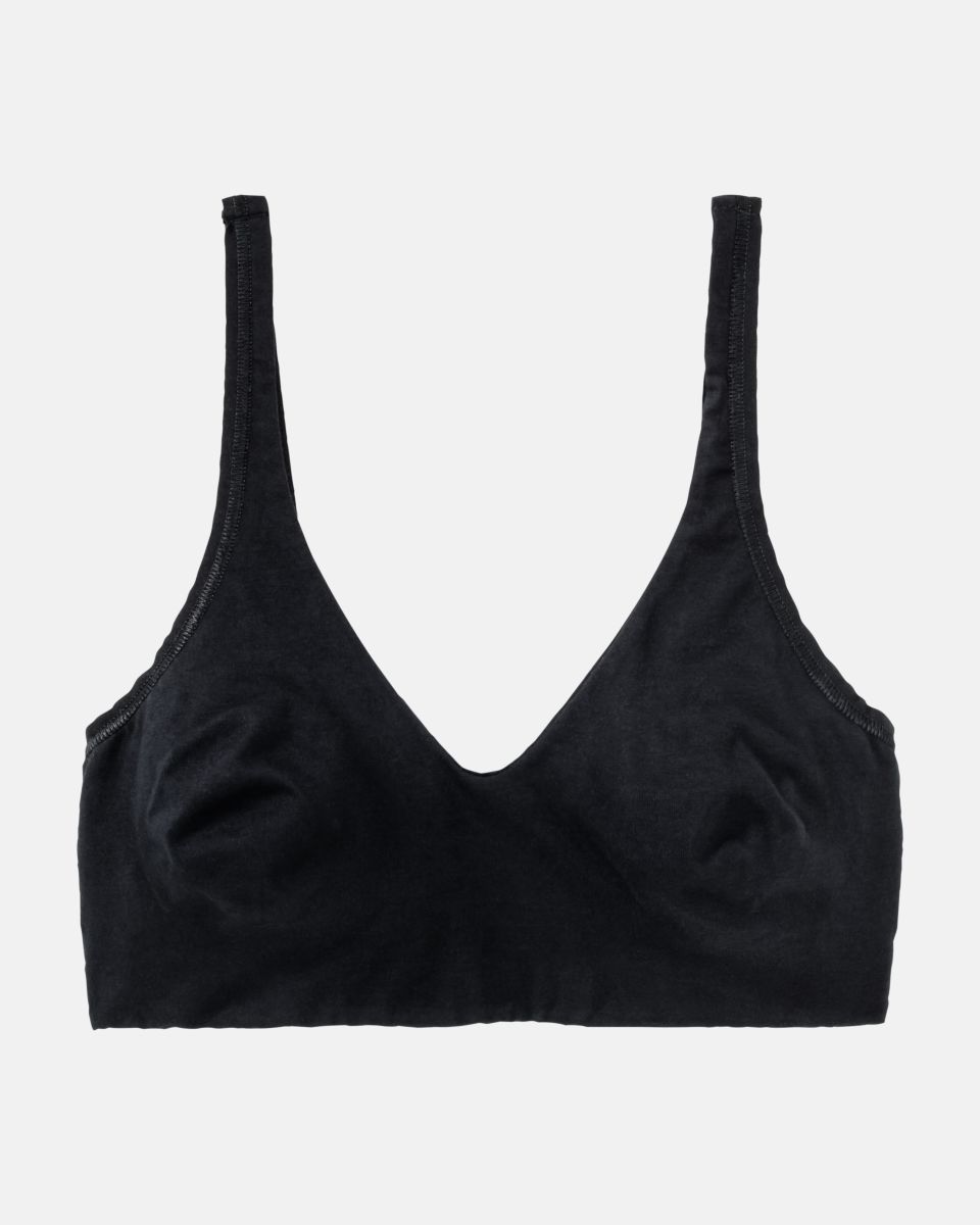 Soft BH gemoldet in schwarz aus der Serie Natural Beauty, flach auf einer Oberfläche liegend.