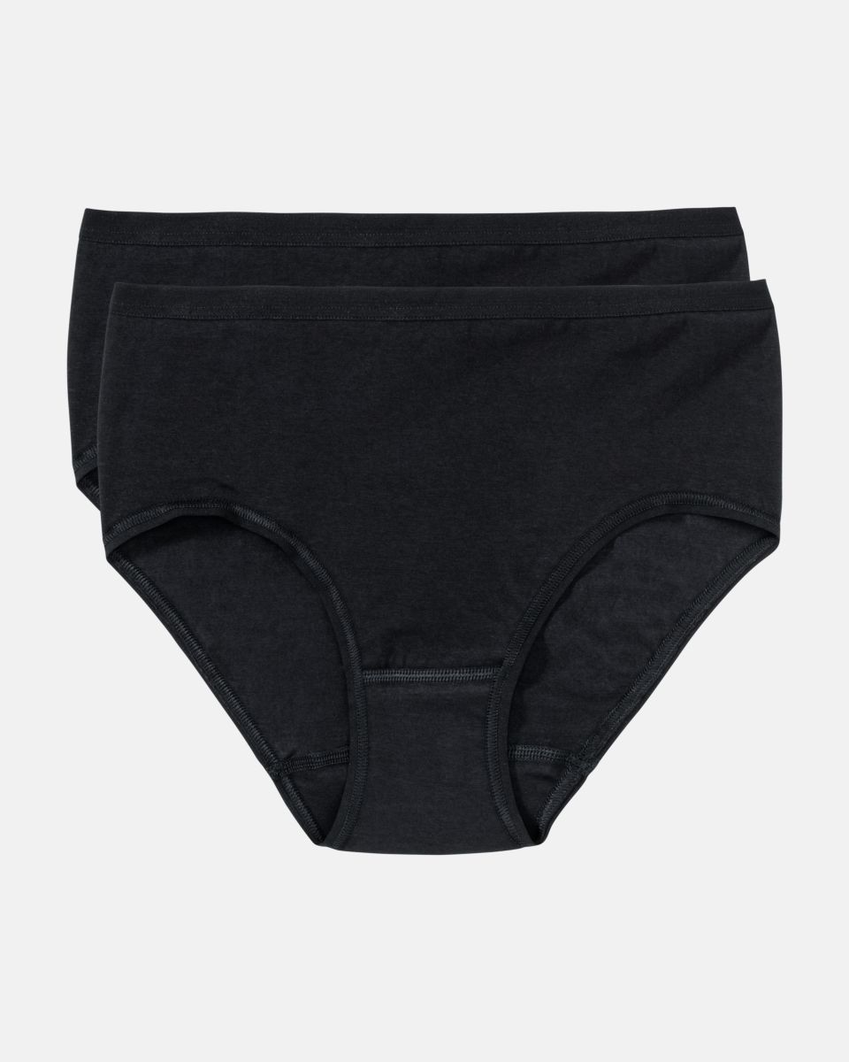 Midislip in schwarz aus der Serie Take two, flach auf einer Oberfläche liegend.