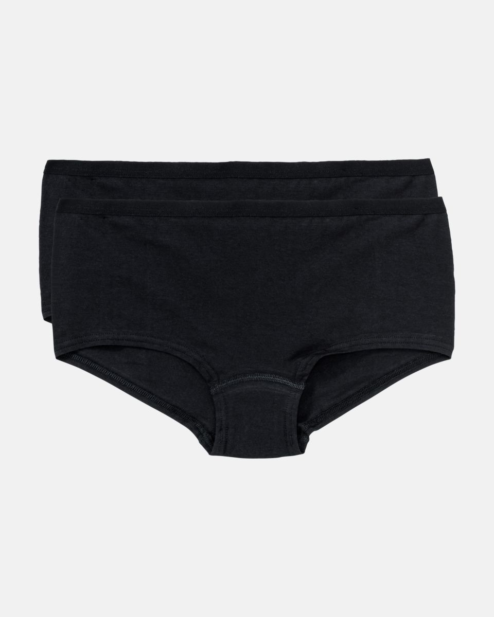 Pant in schwarz aus der Serie Take two, flach auf einer Oberfläche liegend.