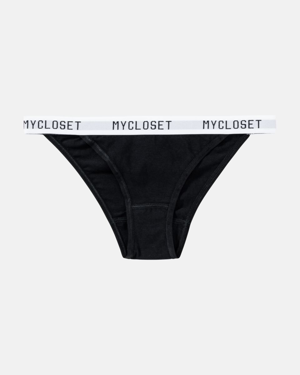 Tanga in schwarz aus der Serie Logo Lover, flach auf einer Oberfläche liegend.