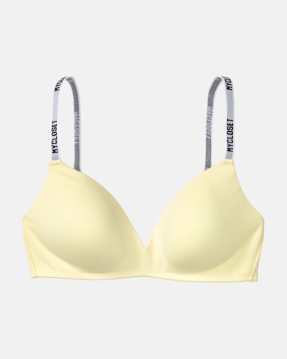 Schalen BH non wired in zitrone aus der Serie Logo Lover, flach auf einer Oberfläche liegend.