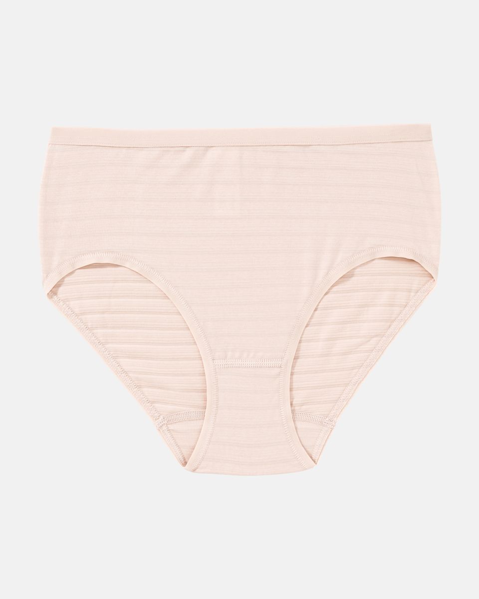 Midislip in honey aus der Serie Cotton&More, flach auf einer Oberfläche liegend.