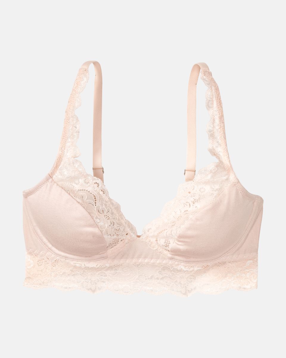 Bügel BH Longline in lychee aus der Serie Sensuelle Lace, flach auf einer Oberfläche liegend.