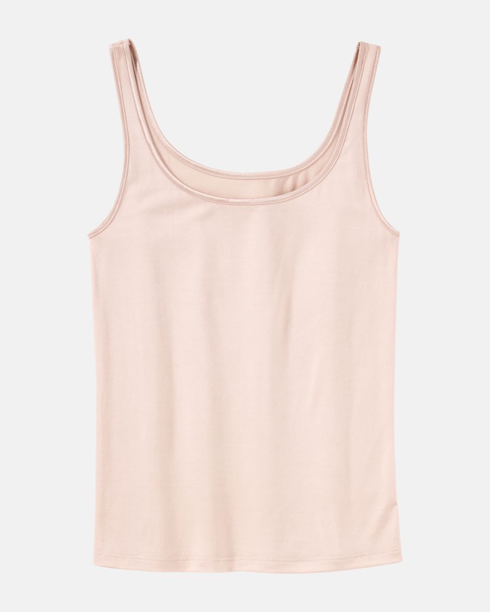 Trägerhemd in honey aus der Serie Selma, flach auf einer Oberfläche liegend.