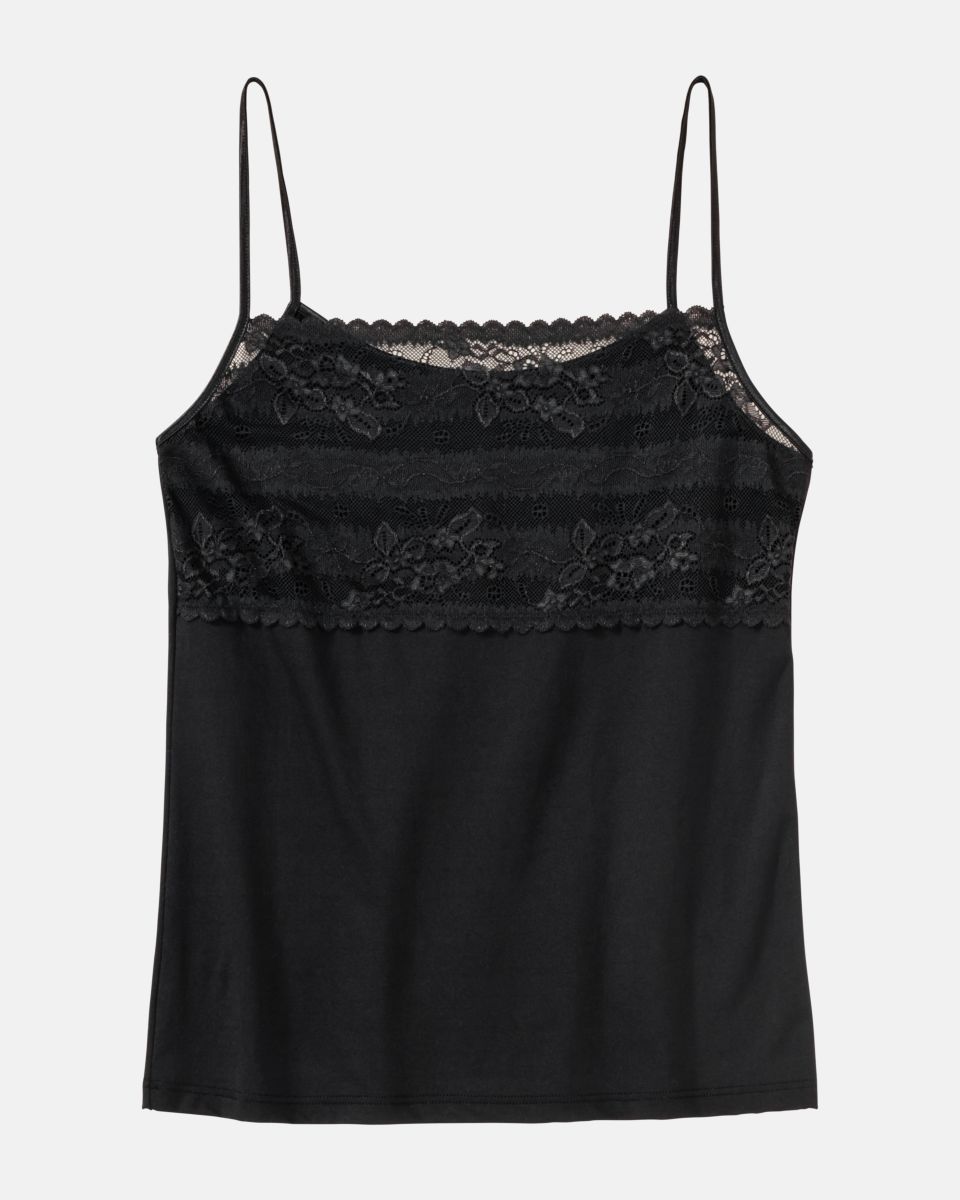 Hemd in schwarz aus der Serie Silvana, flach auf einer Oberfläche liegend.