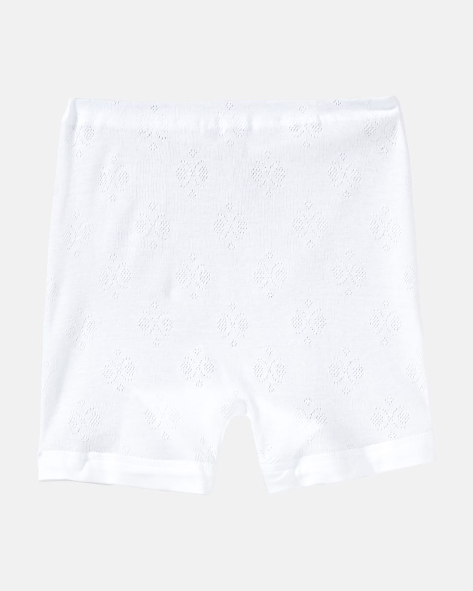 Pagenschlüpfer in weiß aus der Serie Nora, flach auf einer Oberfläche liegend.