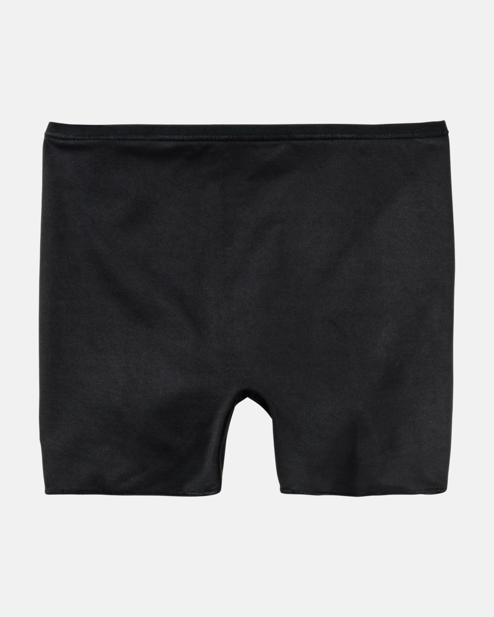 Pant in schwarz aus der Serie Inshape, flach auf einer Oberfläche liegend.