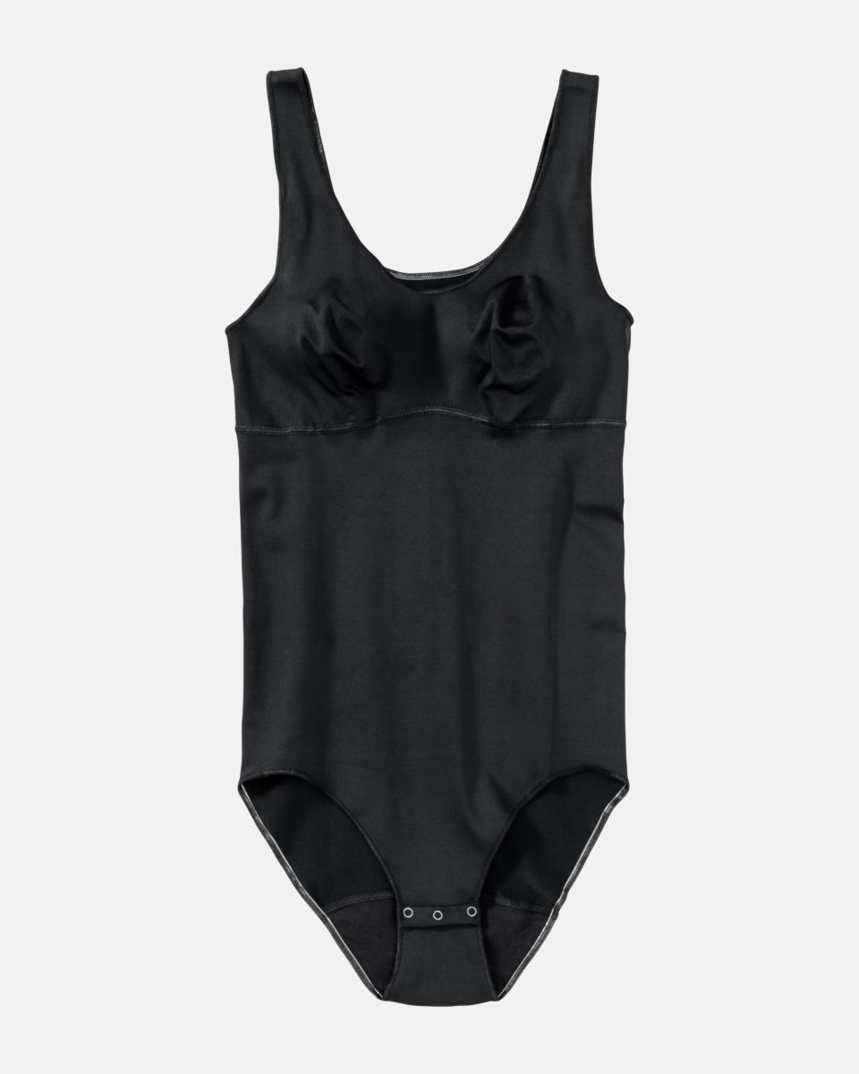 Body gemoldet in schwarz aus der Serie Inshape, flach auf einer Oberfläche liegend.