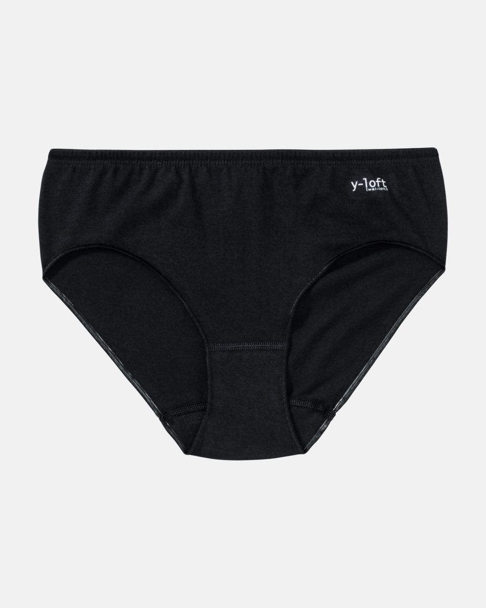 Midislip in schwarz aus der Serie Y-loft, flach auf einer Oberfläche liegend.