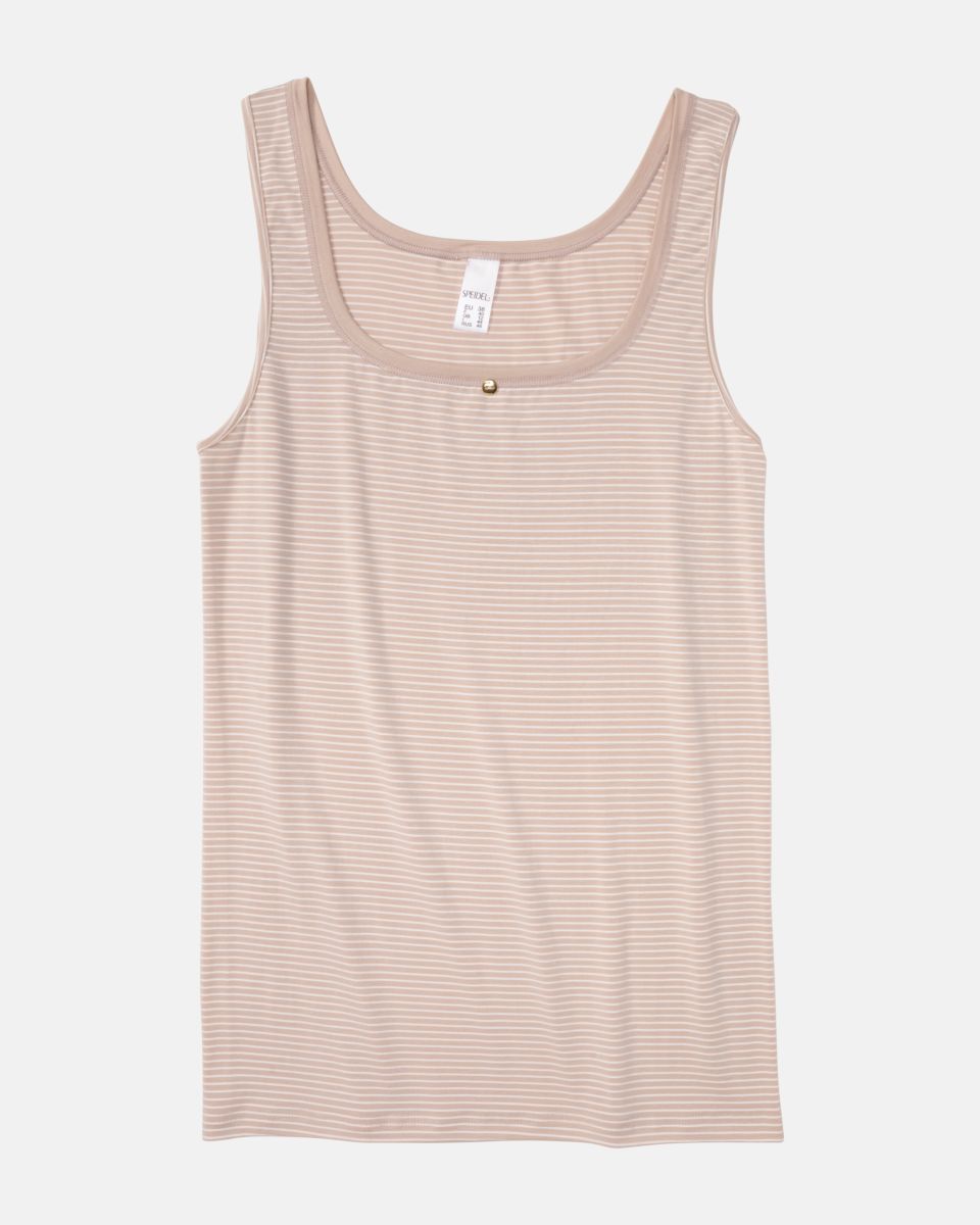 Achselhemd in cashew / off white aus der Serie Rebecca, flach auf einer Oberfläche liegend.