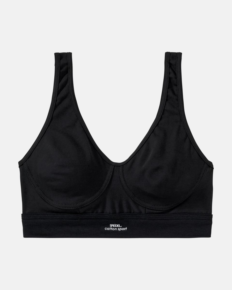 Achselbustier in schwarz aus der Serie Cotton Sport, flach auf einer Oberfläche liegend.