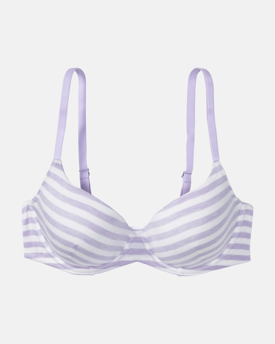 Schalen BH mit Bügel in lavendel / off white aus der Serie Regina, flach auf einer Oberfläche liegend.